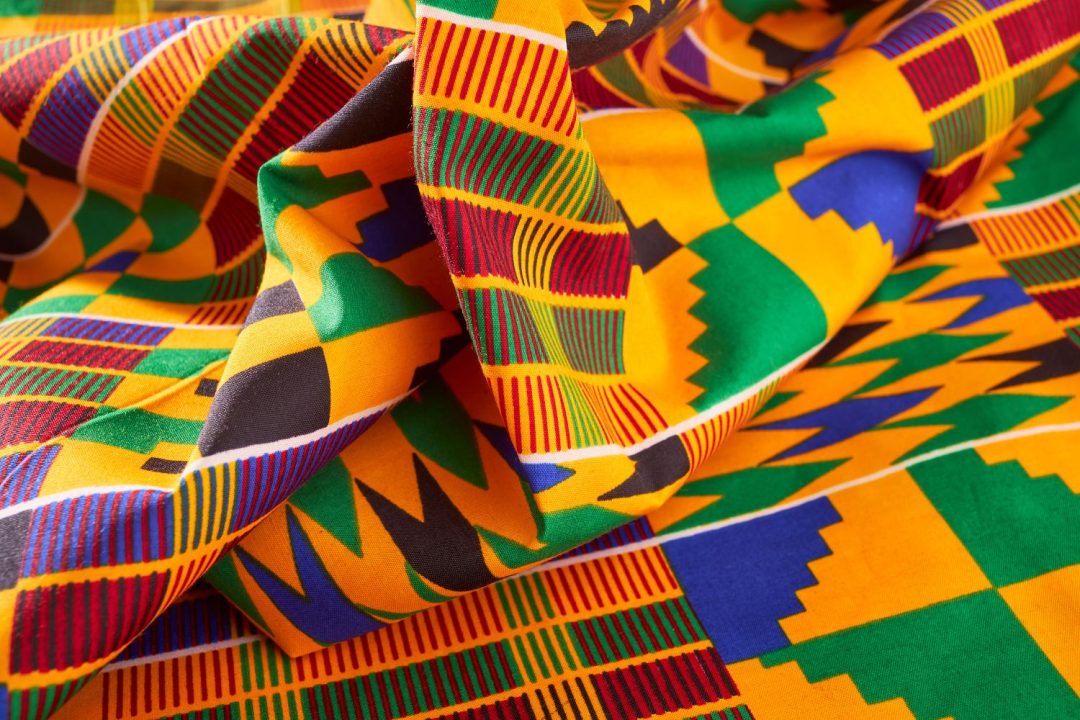 Traditional Kente patterns showing gold, green, and red colors